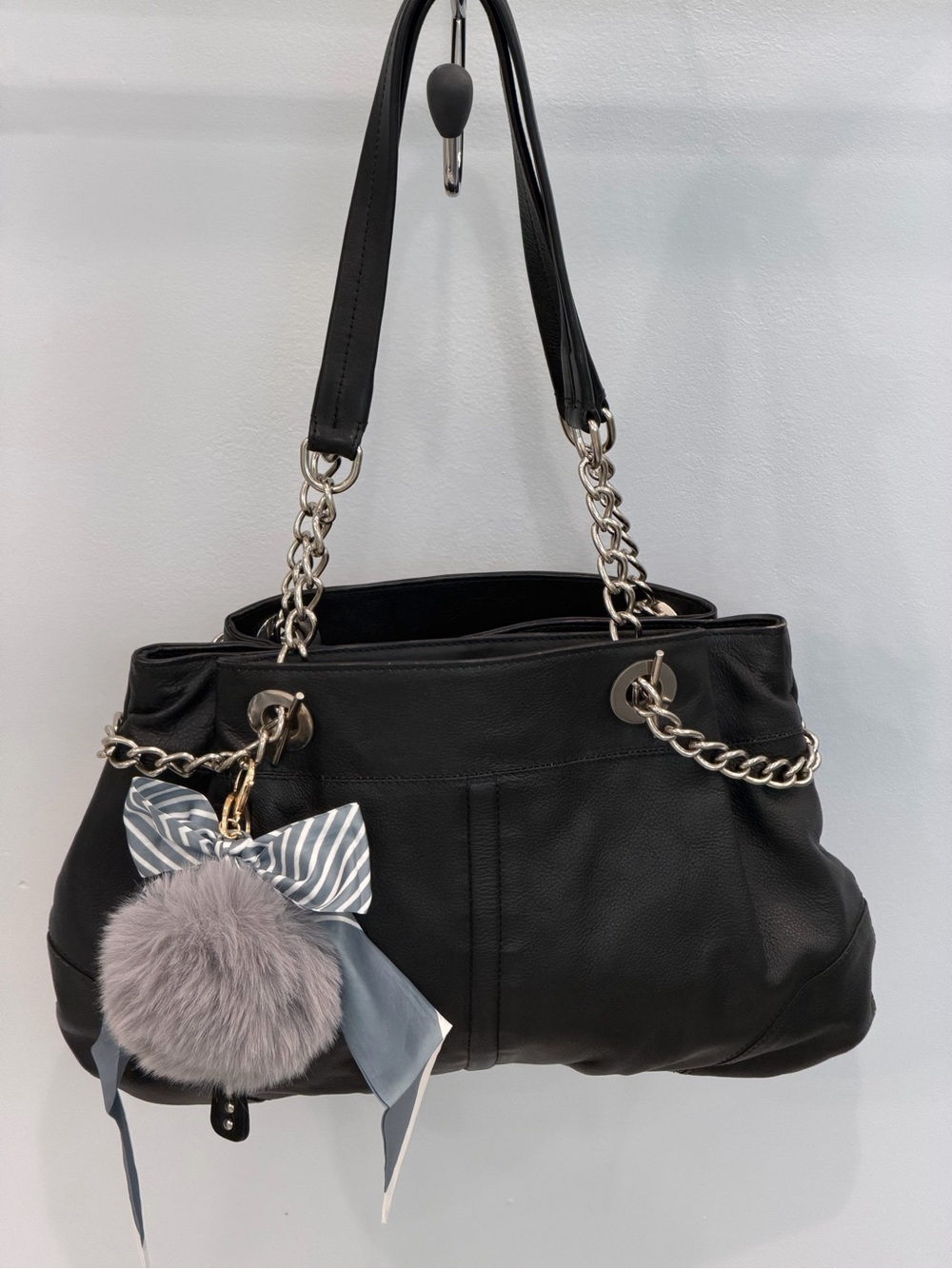Classic Black Shoulder Bag with Silver Chain Handles and Pom Charm